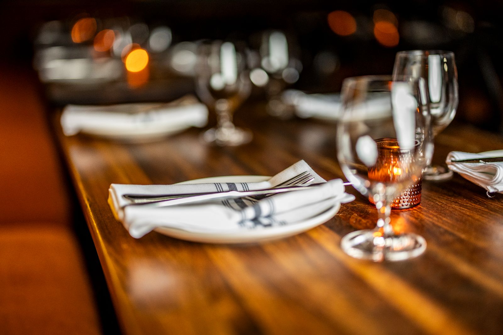 Table setting with linen and candlelight