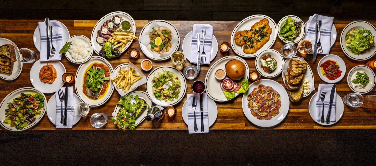 A long table set with dishes at Café Fleuri